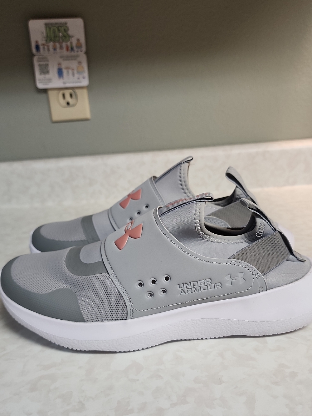 Under Armour womens 9.5 Grey Slip-On Sneakers with Pink Logo number 99